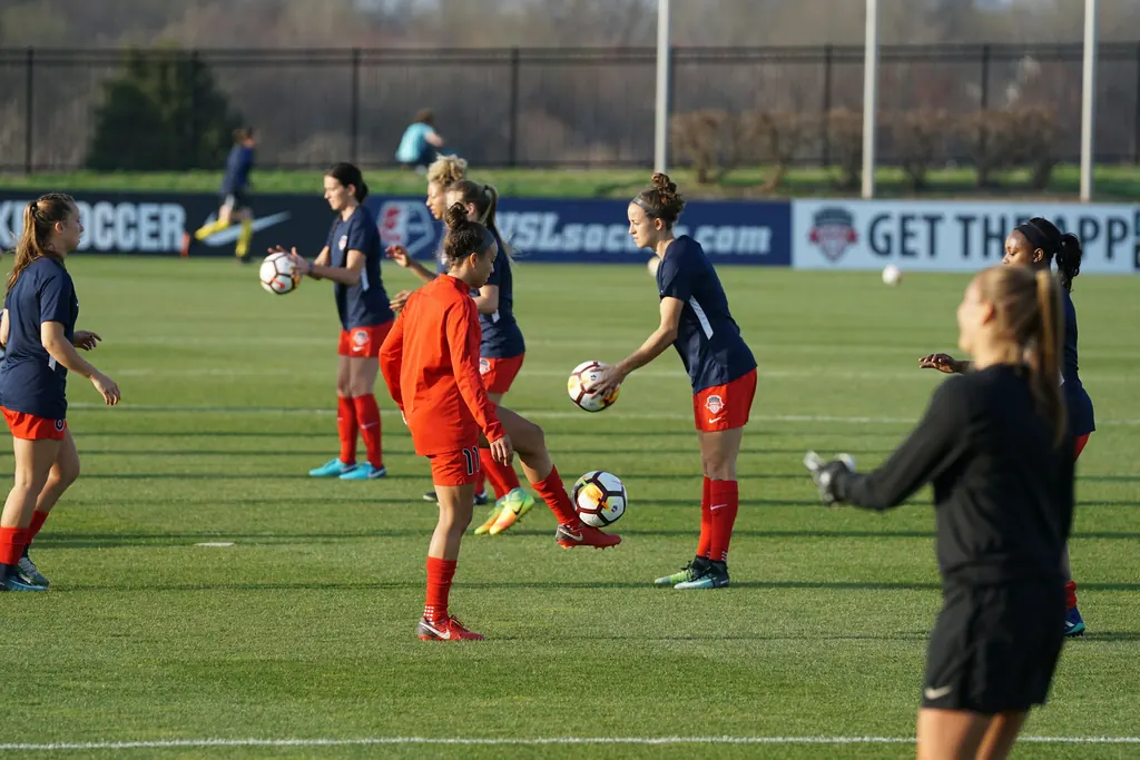 A women's football team training on a pitch