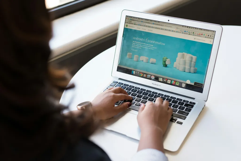 A person browsing a website on a laptop